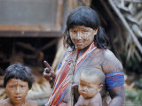 Buy Heavily Painted Tirio Indian Woman Wearing Beads, with Children, Brazil, South America at AllPosters.com