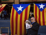 Reading the Newspaper Under the Catalan Flag on La Rambla, Barcelona, Catalonia, Spain