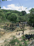 Buy Houses and People Walking in Dry River Bed Caused by Erosion, Near Petionville, Haiti, West Indies at AllPosters.com