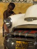 Young Boy Drumming on Old American Car's Bonnet,Trinidad, Sancti Spiritus Province, Cuba