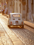 Fiat 500 Driving Down Cobbled Street, Noto, Sicily, Italy