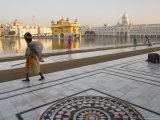 Elderly Sikh Pilgrim with Bundle and Stick Walking Around Holy Pool, Amritsar, India