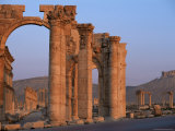 Monumental Arch at Archaeological Site, with Arab Castle Beyond, Palmyra, Syria