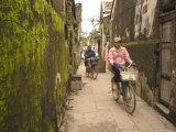 Buy Cycling Through Moss Covered Alley, Hoi An, Vietnam, Southeast Asia at AllPosters.com