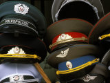 A Pile of Communist Era Army and Police Hats for Sale as Souvenirs, Mitte, Berlin, Germany