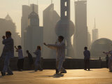 Buy Morning Exercise Against the Background of Lujiazui Finance and Trade Zone, Shanghai, China at AllPosters.com