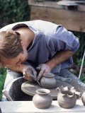 Potter at Work on Wheel at Rustic Fayre, Devon, England, United Kingdom