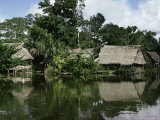 Buy Building on Stilts Reflected in the River Amazon, Peru, South America at AllPosters.com