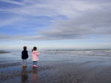Boy Aged Four and Girl Aged Three on a Black Volcanic Sand Beach in Manawatu, New Zealand