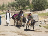 Aimaq People Walking and Riding Donkeys Entering Village, Between Chakhcharan and Jam, Afghanistan