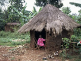 Buy Little Girl Dressed for Church, in Front of Hut, Uganda, East Africa, Africa at AllPosters.com