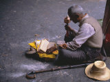 Buy Tibetan Buddhist Pilgrim Reading Texts and Holding Prayer Wheel, Lhasa, China at AllPosters.com