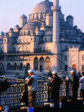 Fishermen on Galata Bridge with Mosque in Background, Istanbul, Turkey