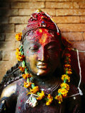 Deity with Garlands and Bindi Powder, Bhaktapur, Bagmati, Nepal