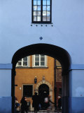 Buy View of Busy Street through an Archway in Stare Miasto, Warsaw, Poland at AllPosters.com