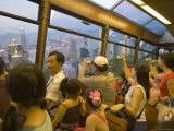 Passengers on the Peak Tram Ascending Victoria Peak, Hong Kong, China