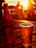 Bottle and Glass of Beer by Lake Vattern at Sunset, Motala, Ostergotland, Sweden
