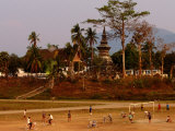 Buy Boys Playing in Front of That Luang Temple, Luang Prabang, Laos at AllPosters.com