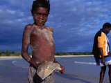 Buy Young Aboriginal Boy with Shovel Nose Fish, Aurukun, Cape York Peninsula, Queensland, Australia at AllPosters.com