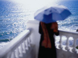 Buy Woman with an Umbrella on a Balcony at AllPosters.com