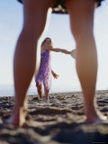 Buy Girl Playing Paddleball on the Beach at AllPosters.com