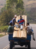 Men Riding on Back of Truck Carrying Timber, Near Esteli, Nicaragua