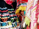 Buy Woman in Traditional Hat Looking through Textiles and Fabric of Stall, Peru at AllPosters.com