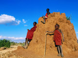 Three Young Maasai Goat Herds on a Termite Mound, Longido, Arusha, Tanzania