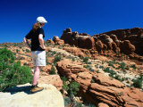Girl Looking Across Rocky Landscape at Fiery Furnace, Arches National Park, Utah