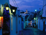 Buy Typical Cobbled Lane in Trulli District at Dusk, Alberobello, Puglia, Italy at AllPosters.com