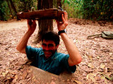 American Visitor Explores Tunnel at Former War Time Cu Chi Tunnel System, Ho Chi Minh, Vietnam Photographic Print