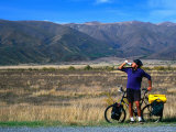 Buy Cyclist Having a Drink on the Side of the Highway between Twizel and Omarama, Otago, New Zealand at AllPosters.com