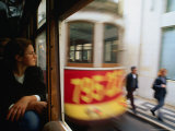 Buy Female Passenger at the Window of a Tram, Lisbon, Portugal at AllPosters.com