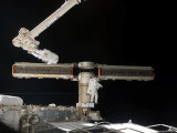 Buy Astronaut Completes the Delicate Process of Folding an Older Solar Array on the ISS, June 15, 2007 at AllPosters.com