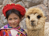 Girl in Native Dress with Baby Alpaca, Sacsayhuaman Inca Ruins, Cusco, Peru