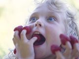 Girl Eating Raspberries, Bellingham, Washington, USA
