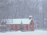 Old Red Schoolhouse and Forest in Snowfall at Christmastime, Michigan, USA