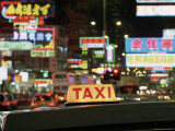 Taxi Sign and Neon Lights at Night on Nathan Road, Kowloon, Hong Kong, China, Asia