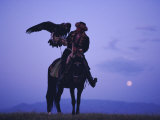 Buy Kalanash Sarsembek with Eagle, a Hunter's Moonrise Over Steppe, Kazakhstan, Central Asia at AllPosters.com