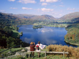 Buy Couple Resting on Bench, Viewing the Lake at Grasmere, Lake District, Cumbria, England, UK at AllPosters.com