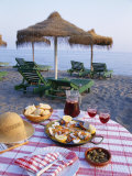 Buy Paella with Olives, Bread and Sangria on a Table on the Beach in Andalucia, Spain at AllPosters.com