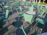 Empty Tables and Chairs Outside Cafe in Venice, Italy
