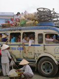 Buy Crowded Bus with Bicycles, Sacks and Passengers on Roof, City Bus Terminal, Vietnam, Indochina at AllPosters.com