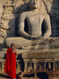 Monk in Front of the Seated Buddha Statue, Gol Vihara, Polonnaruwa, Sri Lanka, Asia