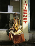 Buy Sadhu Sitting Outside an Internet Cafe, Varanasi, Uttar Pradesh State, India at AllPosters.com