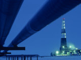 Alaska Oil Pipeline and Oil Rig at Night