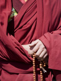 Close Up of a Buddhist Monk's Hands with Prayer Beads, Qinghai, China