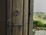 Close View of a Wooden Door on a Villa Opening to Hills of Tuscany, Italy