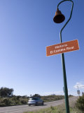 Historic el Camino Real Marker on Highway 101 and Car Whizzing Past, California