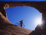 Buy Mountain Biker Stands under an Arch at AllPosters.com